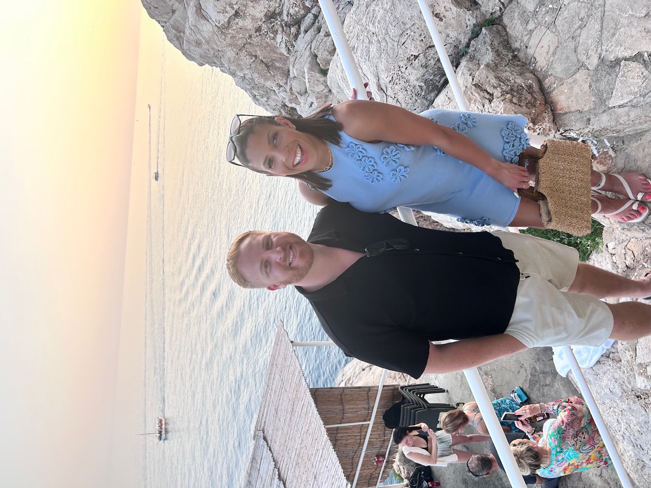 Tim and Sophie above the sea at sunset