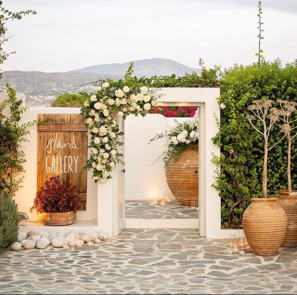 The flower-framed entrance to Island Gallery on the Athens Riviera